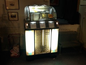 A 1954 Jukebox, left behind by, plays only 50's tunes.